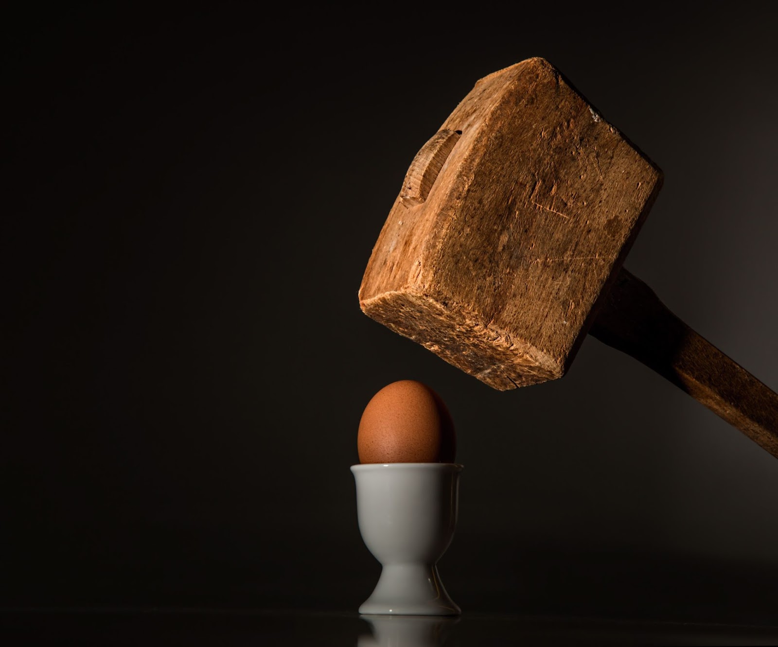 Hammer cracking an egg